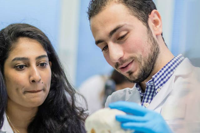 Refugee dentist Rawad Qaq pledges to help fix Syria after his graduation