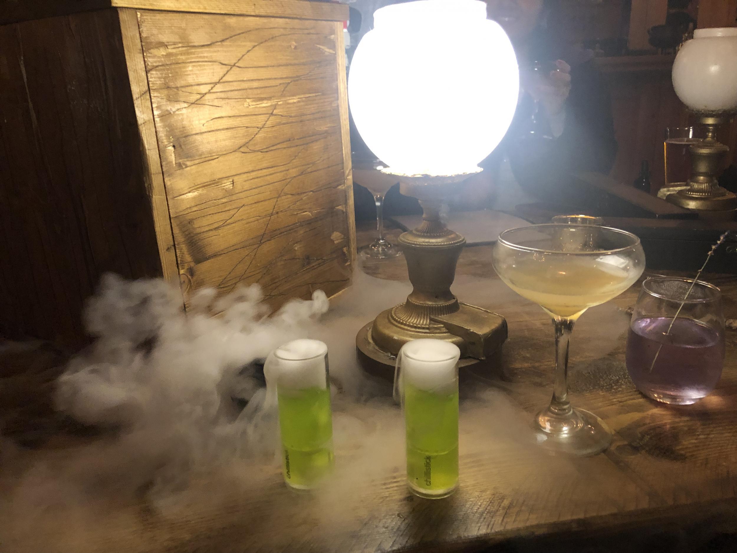 The cocktails bubble and smoke