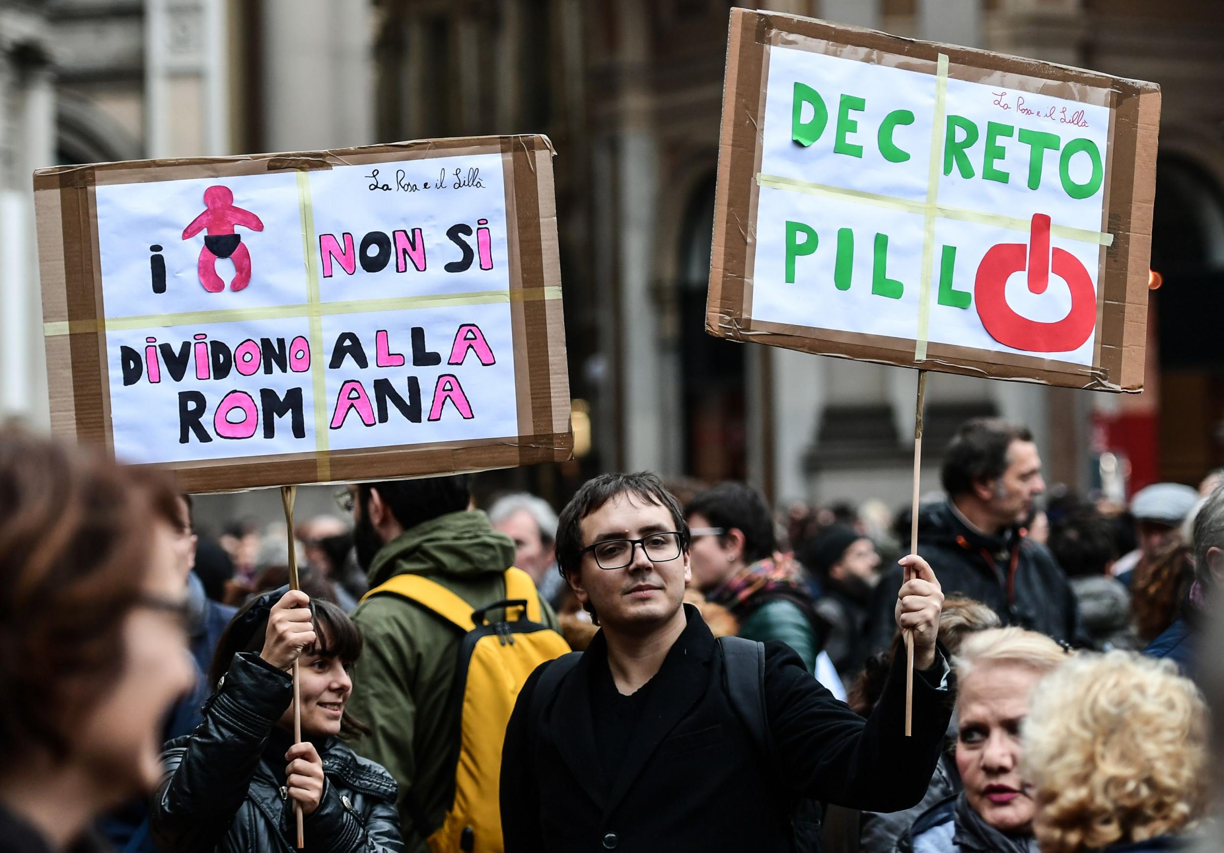 People gather on Piazza della Scala in Milan on 10 November 2018 to protest the so-called Pillon draft bill aimed at changing the rules on the separation of couples and the custody of children