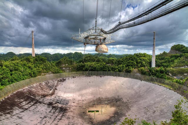 The Arecibo Observatory radio telescope in the hills of Arecibo, Puerto Rico