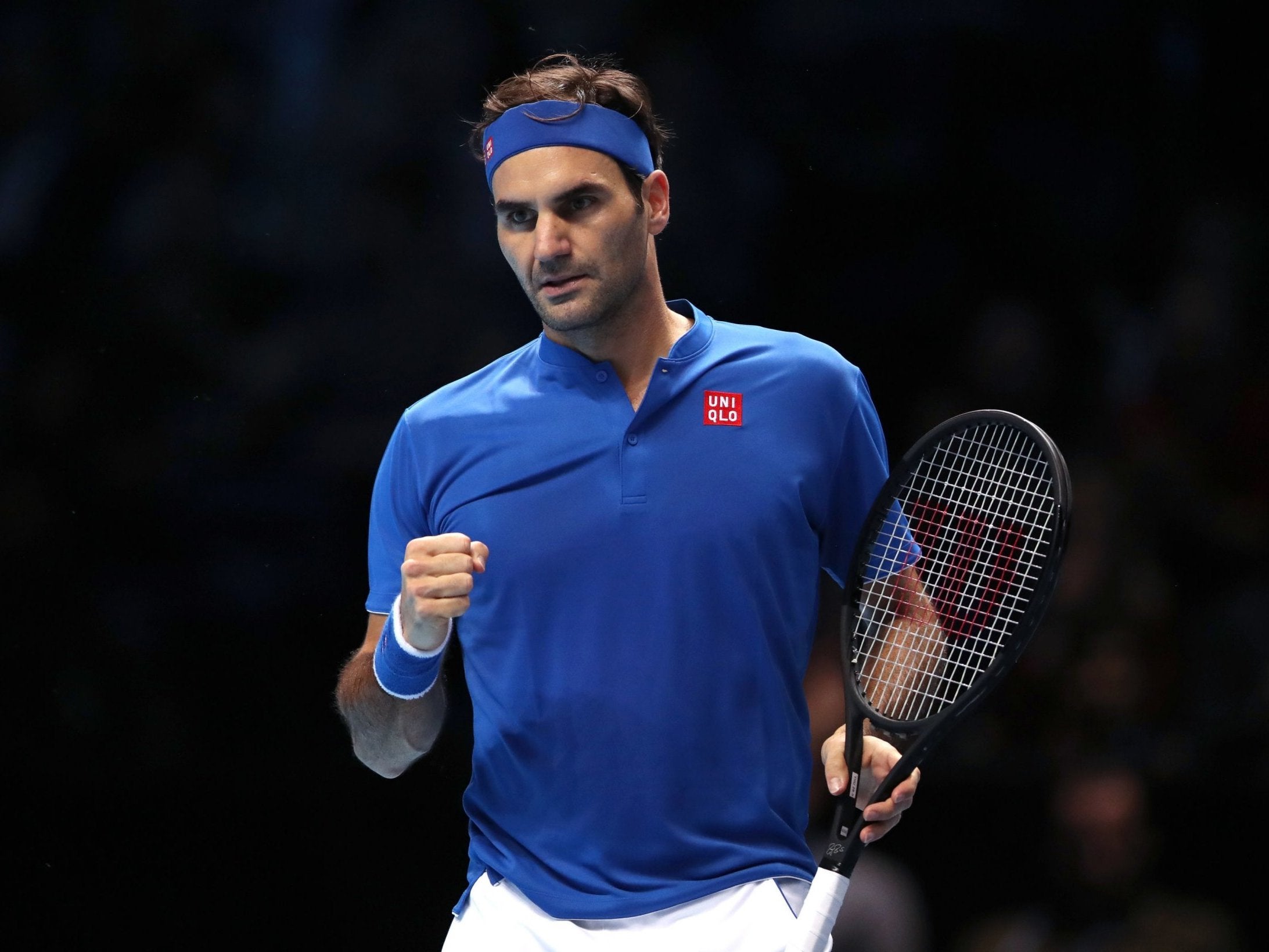 Roger Federer celebrates a point during the first set