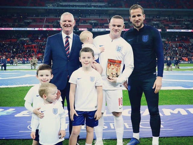 Wayne Rooney poses with his family and Harry Kane ahead of his final appearance for England