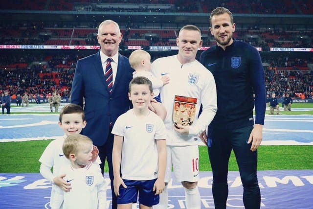 Wayne Rooney poses with his family and Harry Kane ahead of his final appearance for England