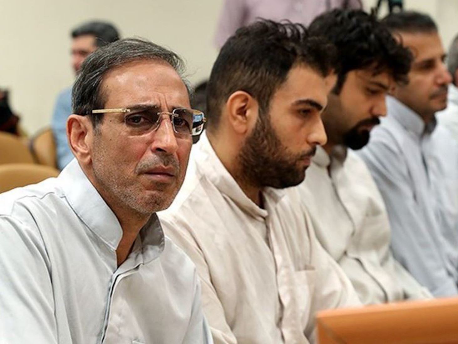 Iranian gold trader Vahid Mazloumin (left) during his trial in September on corruption charges