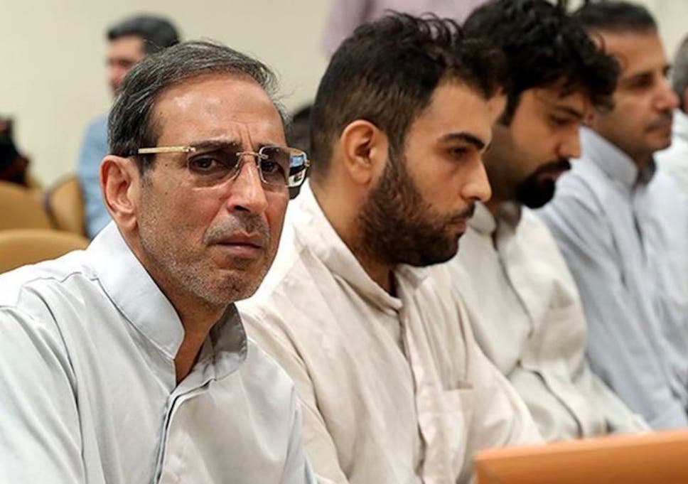 Iranian gold trader Vahid Mazloumin (left) during his trial in September on corruption charges