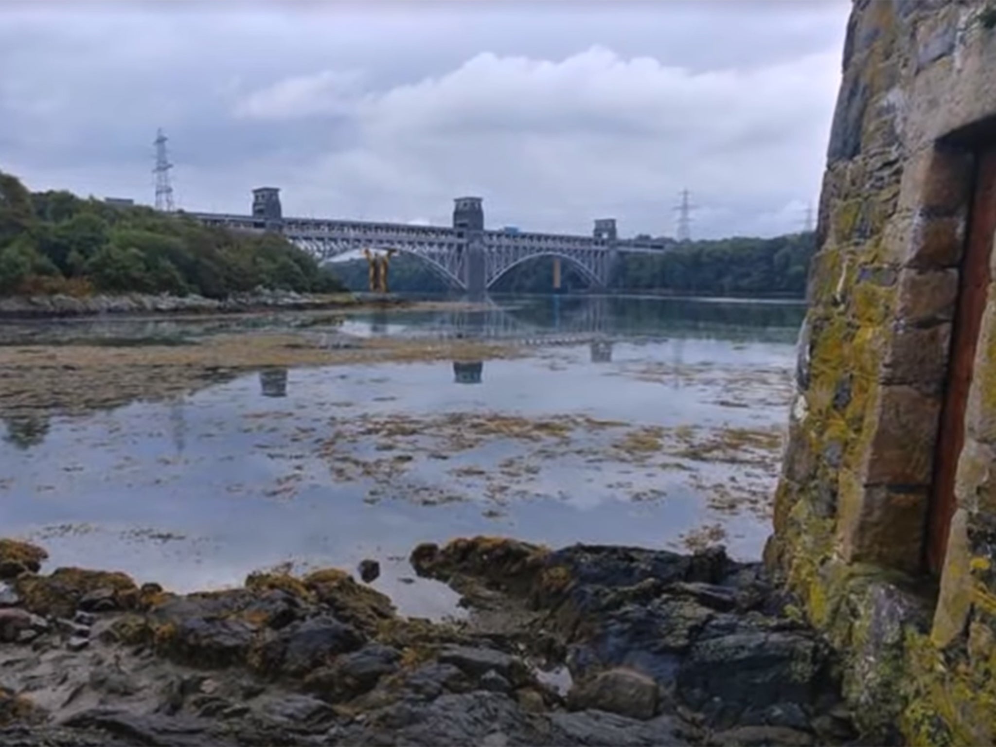 Britannia Bridge, one of two over the strait, with the new bridge drawn in by the designer just visible behind it