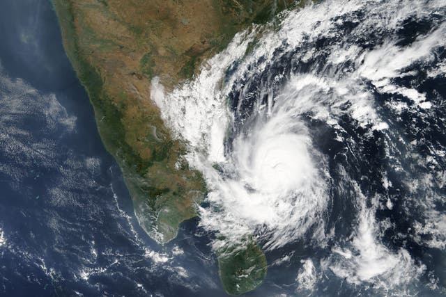 A Nasa satellite image shows Cyclone Gaja reaching the east coast of India late Thursday