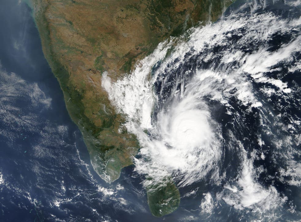 A Nasa satellite image shows Cyclone Gaja reaching the east coast of India late Thursday