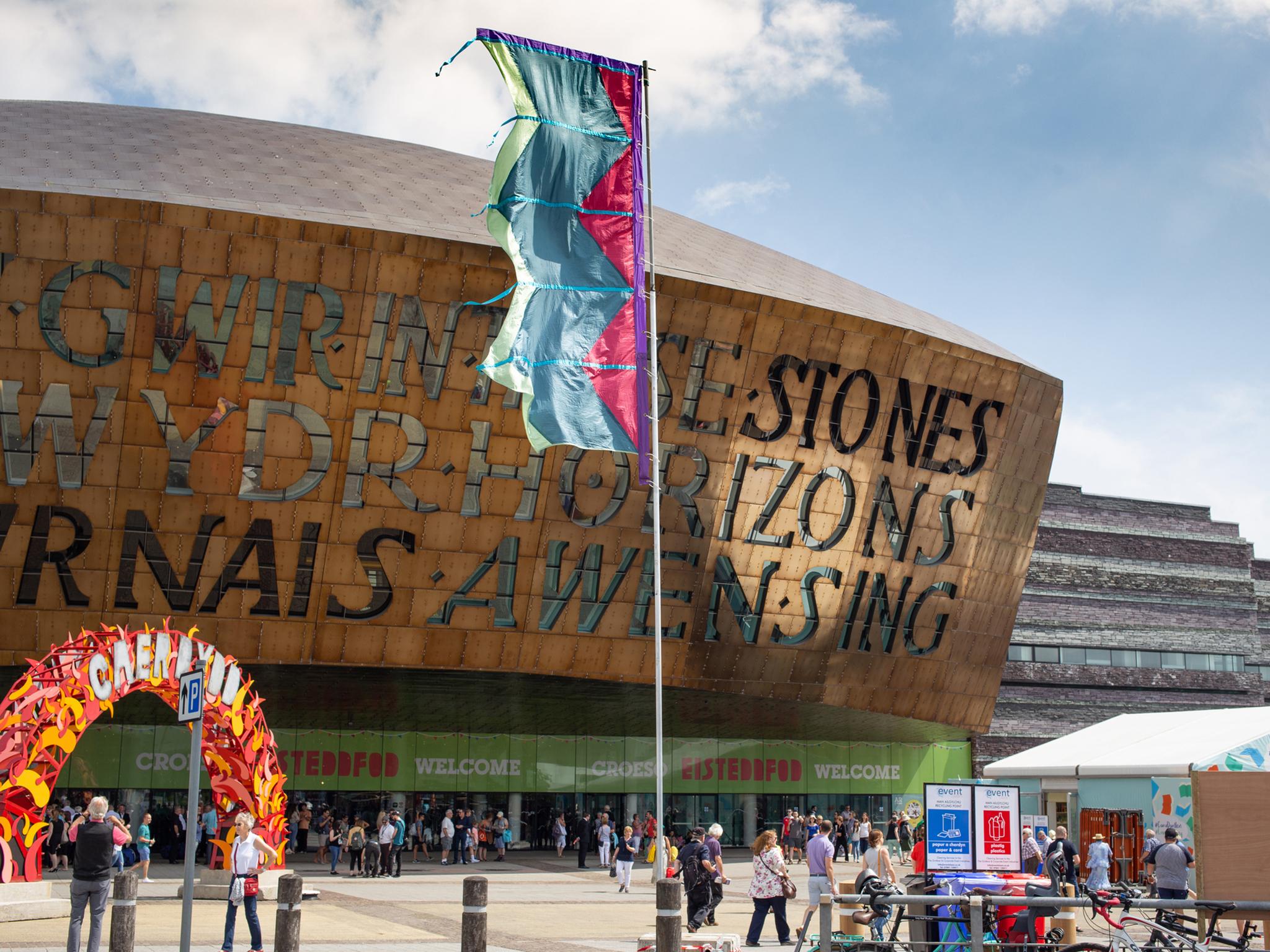 The Wales Millennium Centre in Cardiff Bay, with the words ‘in these stones horizons sing’ written across it (Getty)
