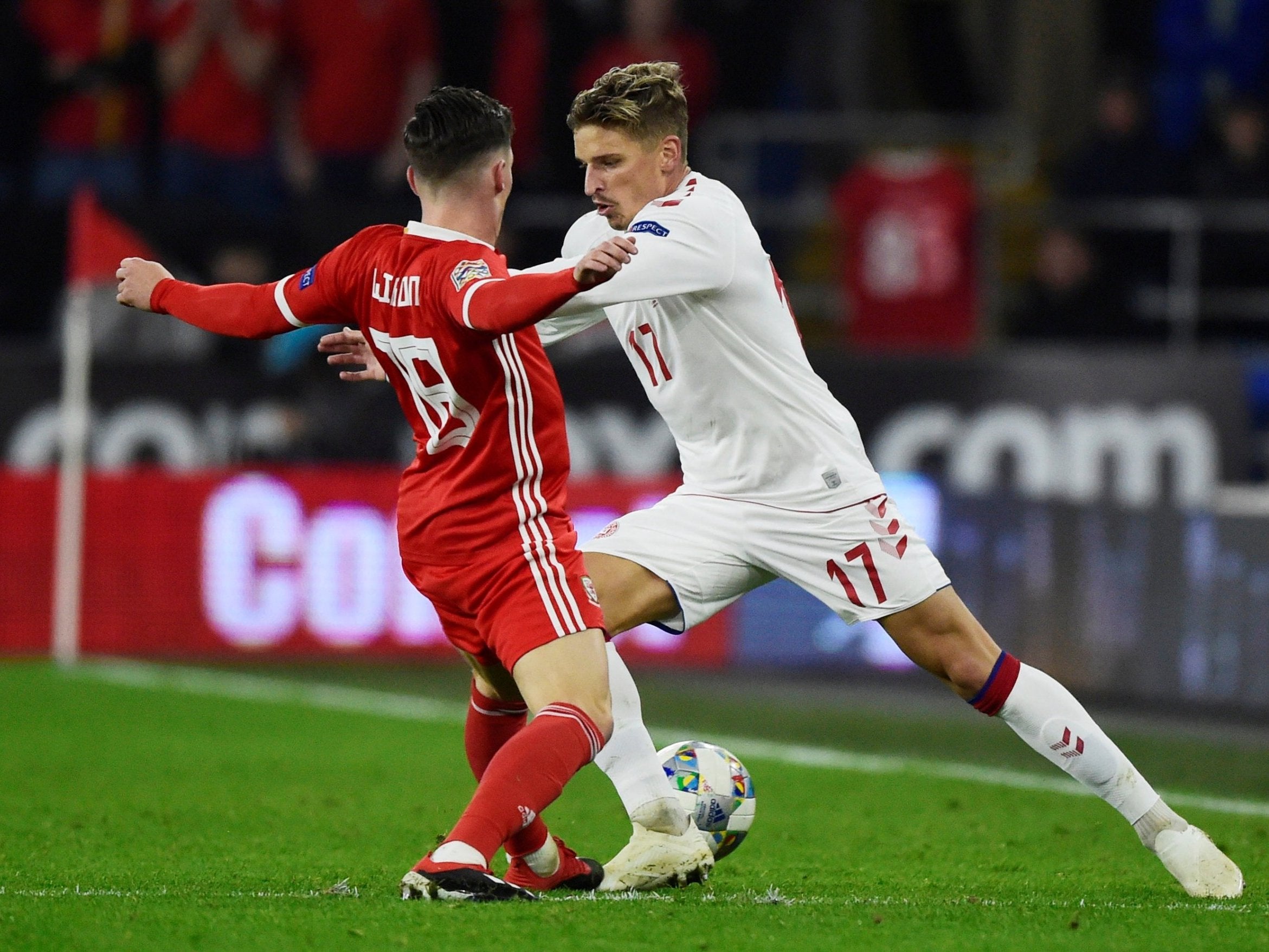 Denmark's Jens Larsen takes on Harry Wilson