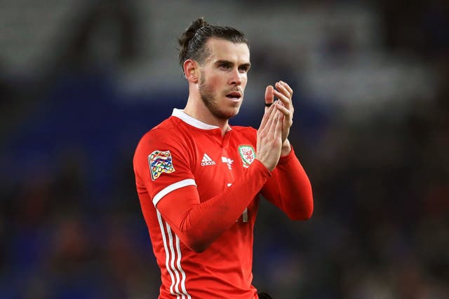 Gareth Bale applauds Welsh fans after the defeat