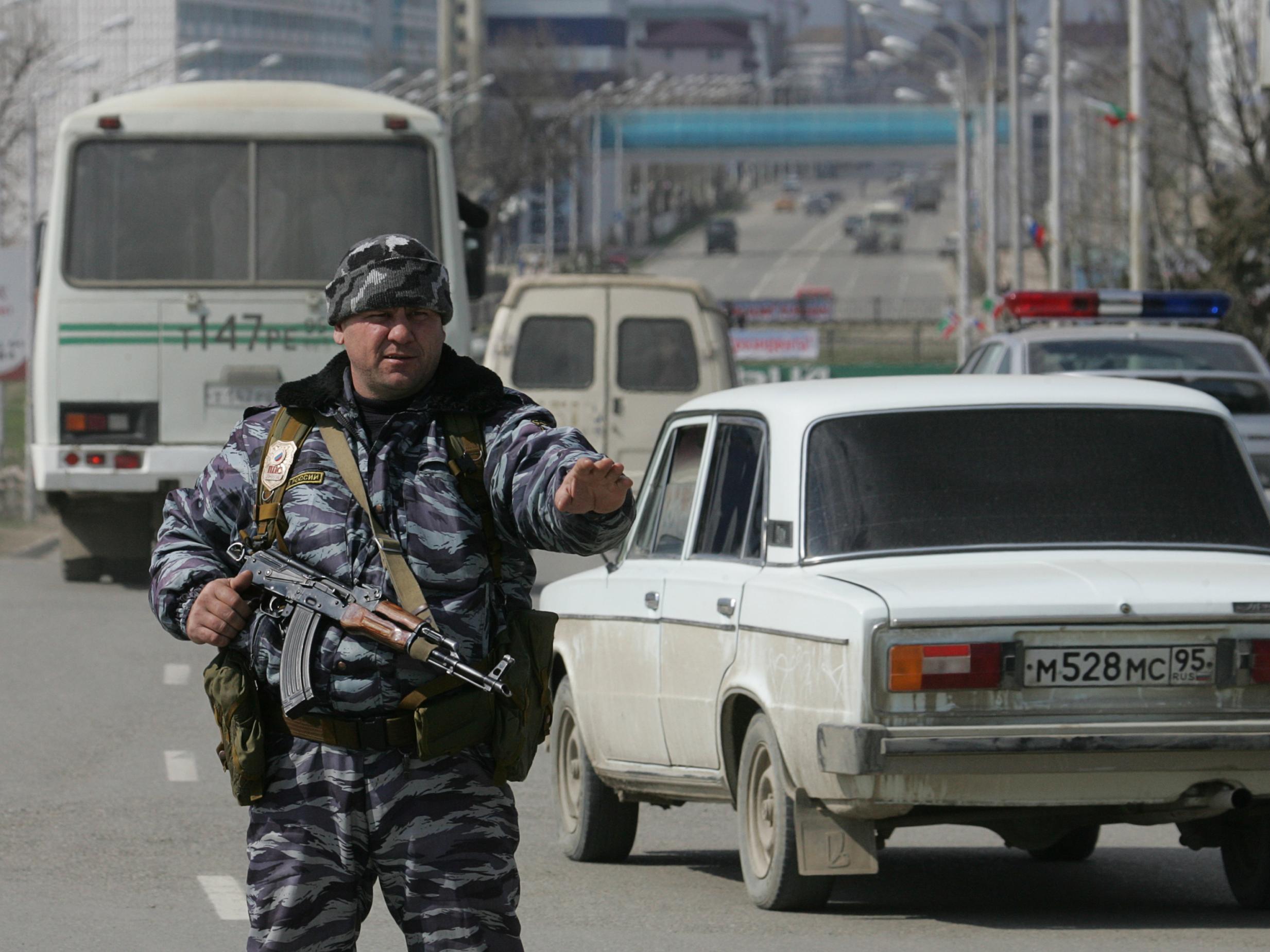 A Chechen policeman stands guard in Grozny