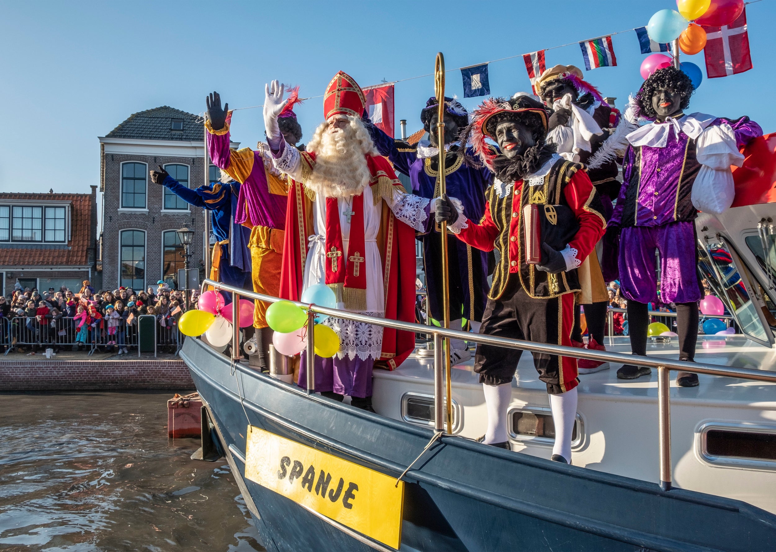 A shrinking majority of Dutch people say there is no reason to change a holiday tradition (pictured) they consider to be harmless fun.