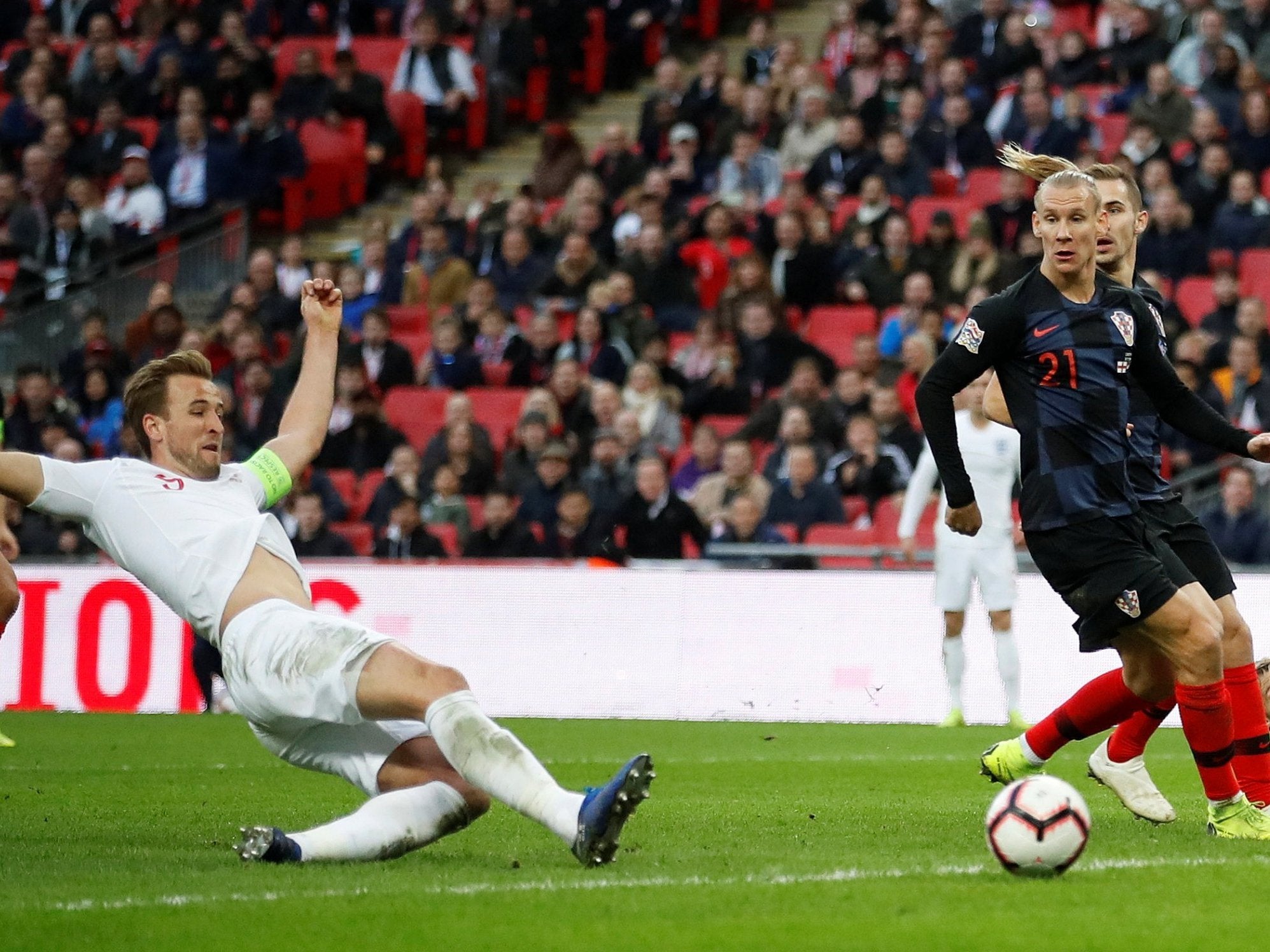 Harry Kane slides to score England's winner