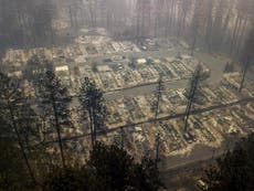 Wildfire search teams step up efforts to find remains before rain hits