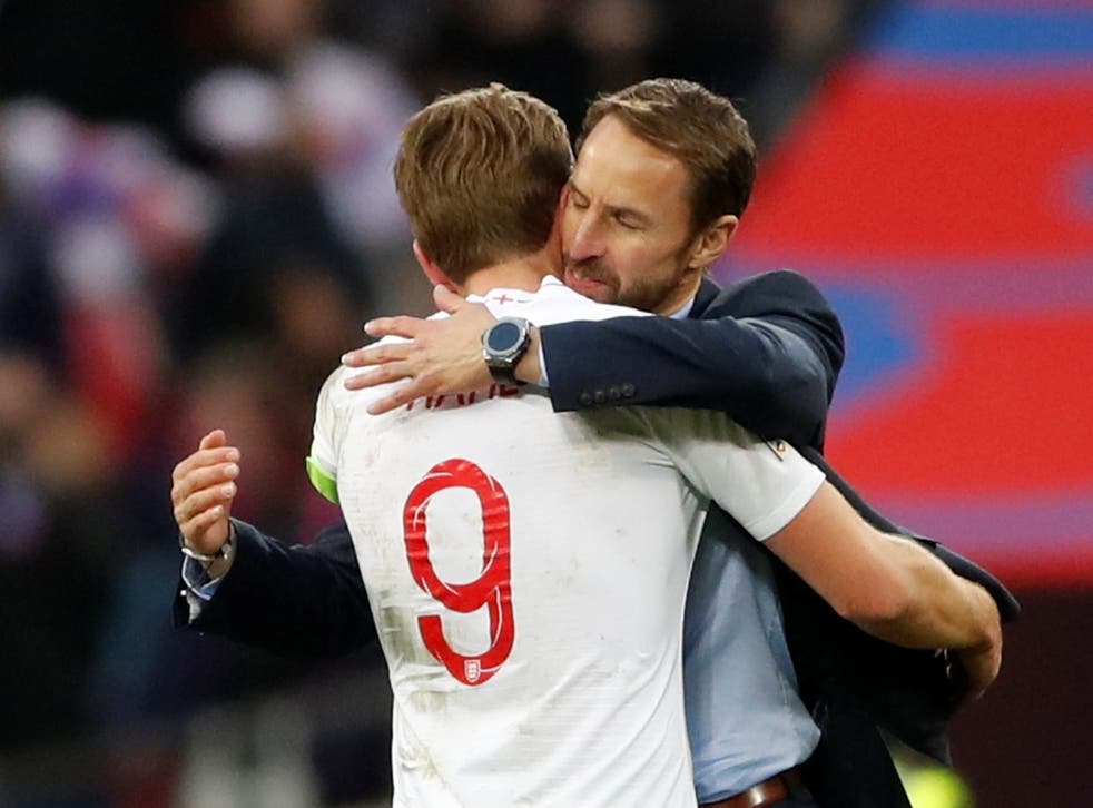 Gareth Southgate embraces Harry Kane after full-time