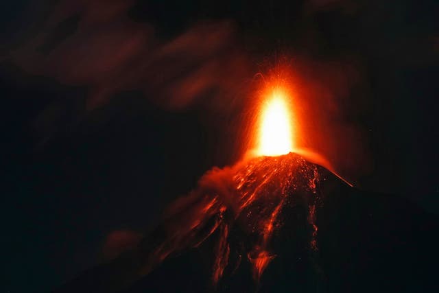 The Volcano of Fire spews hot molten lava from its crater in Antigua, Guatemala, early on Monday, 19 November