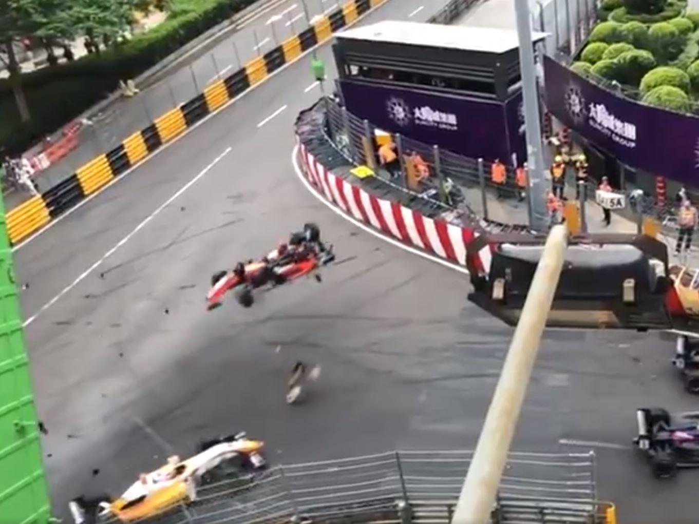 Sophia Floersch's Formula 3 car flies through the air before hitting a photographers' building