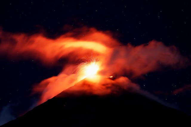 Volcano of Fire mount spews hot ashes and lava, as seen from Alotenango, Guatemala, on 18 November 2018