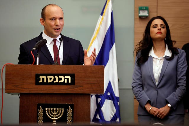 Israeli Education Minister Naftali Bennett and Justice Minister Ayelet Shaked deliver statements to members...