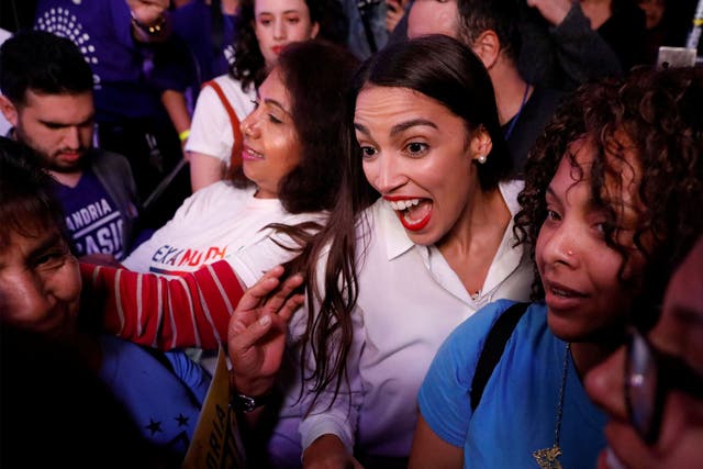 Alexandria Ocasio-Cortez, centre right, was one of the winners in the blue surge and will take her seat in congress in January
