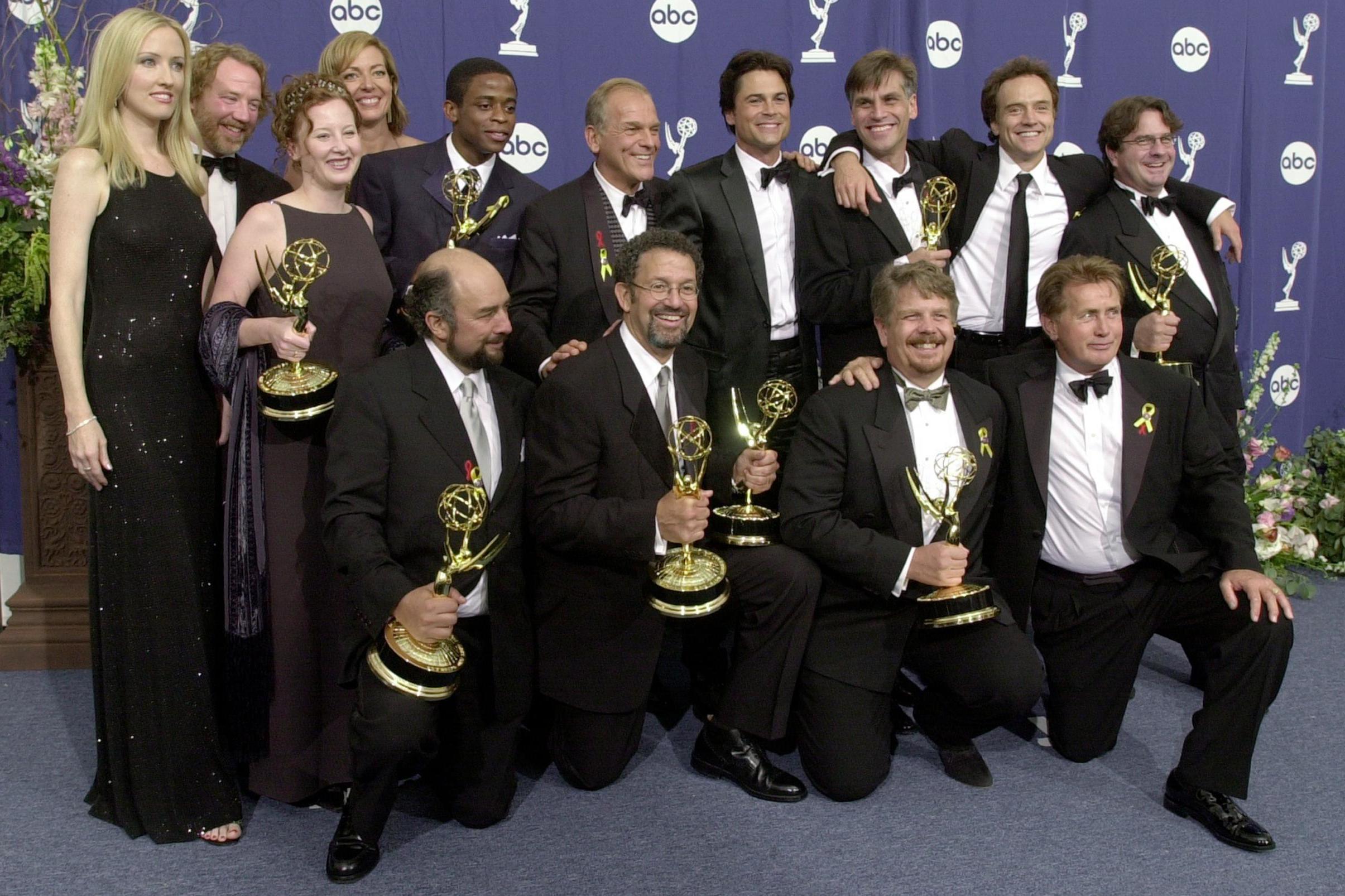 The producers, writers and cast of The West Wing pose with their awards for Outstanding Drama Series backstage at the 52nd Annual Primetime Emmy Awards on 10 September, 2000 in Los Angeles, CA. The cast won a record nine Emmys.