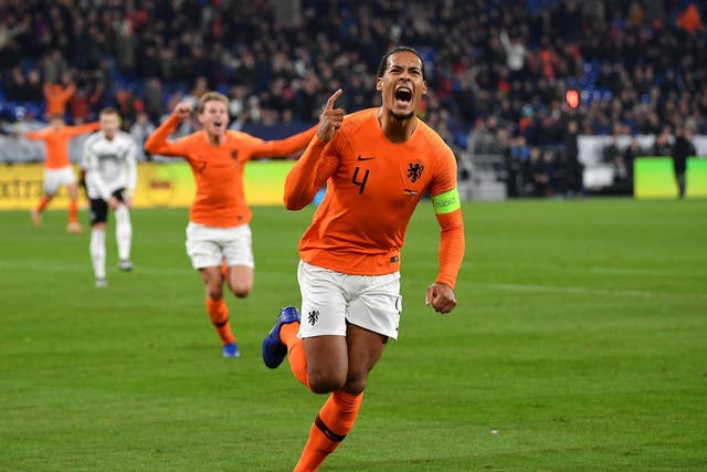 Virgil van Dijk celebrates his late equaliser for the Netherlands