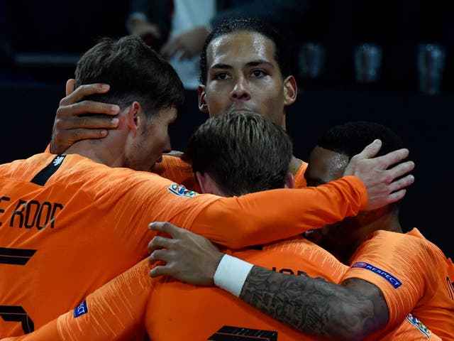 Netherlands' defender Virgil van Dijk celebrates scoring