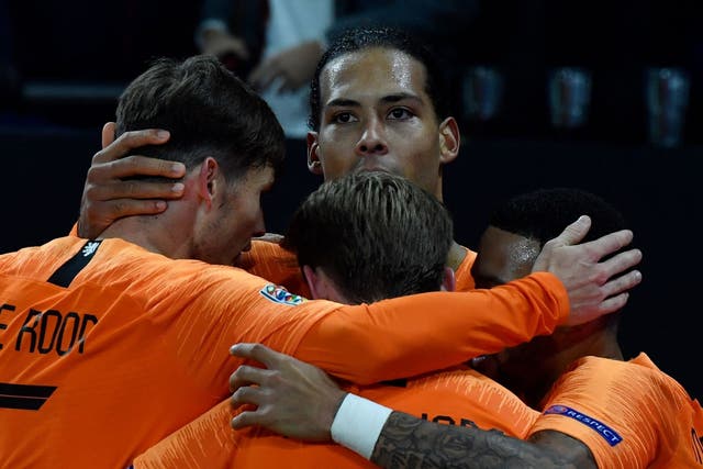 Netherlands' defender Virgil van Dijk celebrates scoring