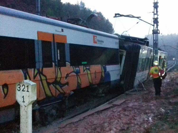 Train north of Barcelona derails after being struck by landslide