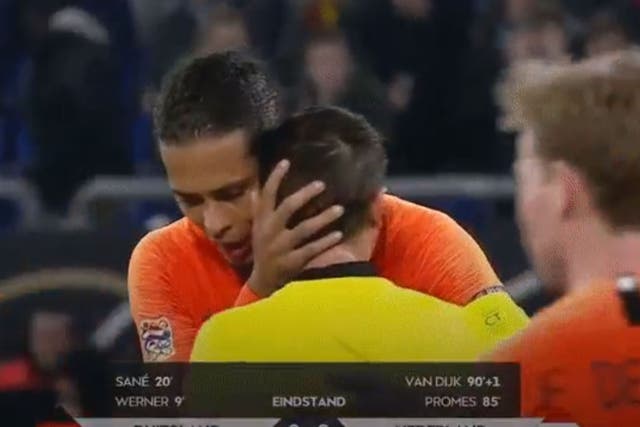 Virgil van Dijk comforted referee Ovidiu Hategan after the final whistle