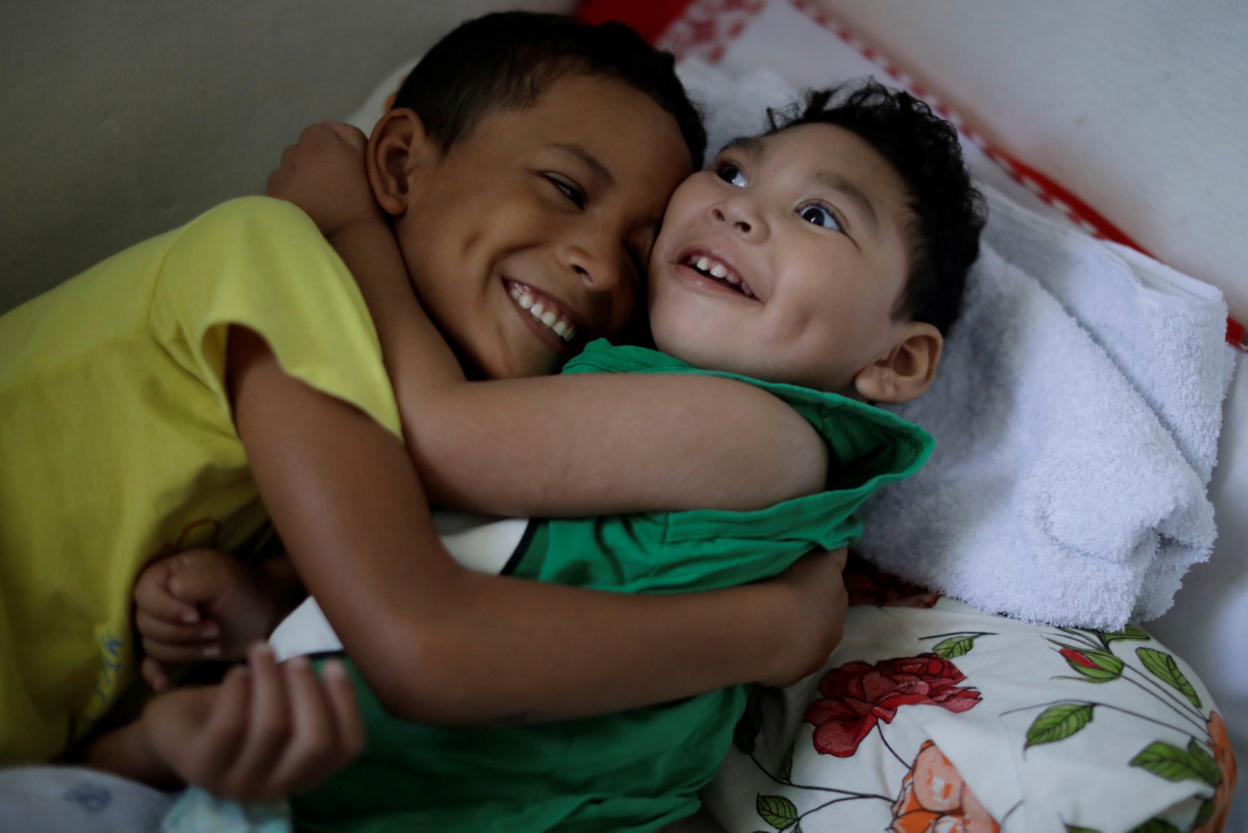 Daniel Vieira receives a big hug from his brother when he returns home