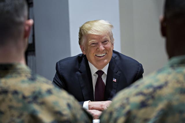 President Donald Trump comes under fire for being 'too afraid' to visit US troops in combat zones