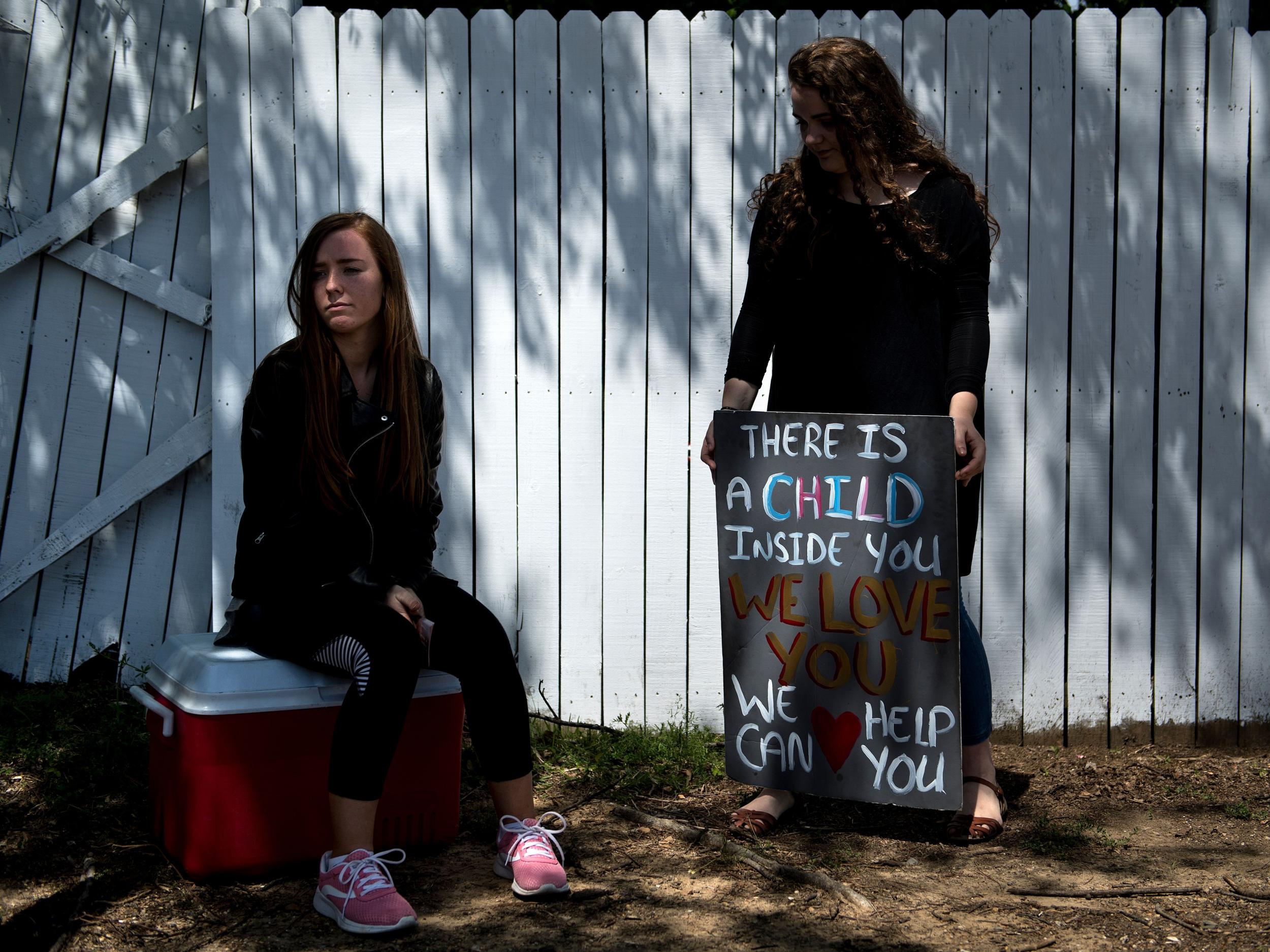 Pro-life activists wait for patients to arrive outside the Jackson Women's Health Organisation, the last abortion clinic in Mississippi.