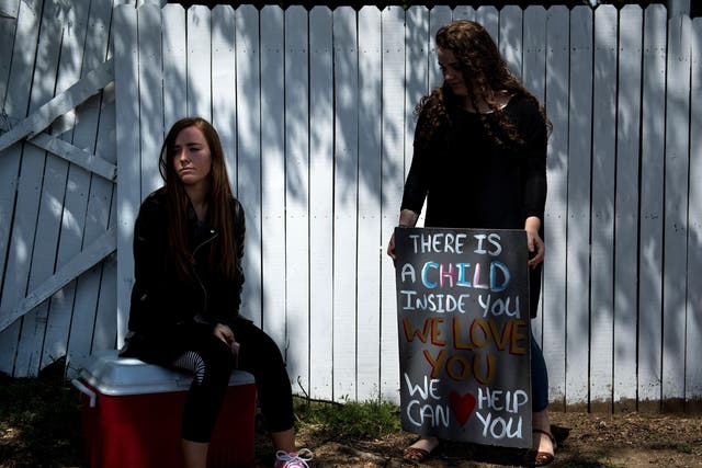 Pro-life activists wait for patients to arrive outside the Jackson Women's Health Organisation, the last abortion clinic in Mississippi.