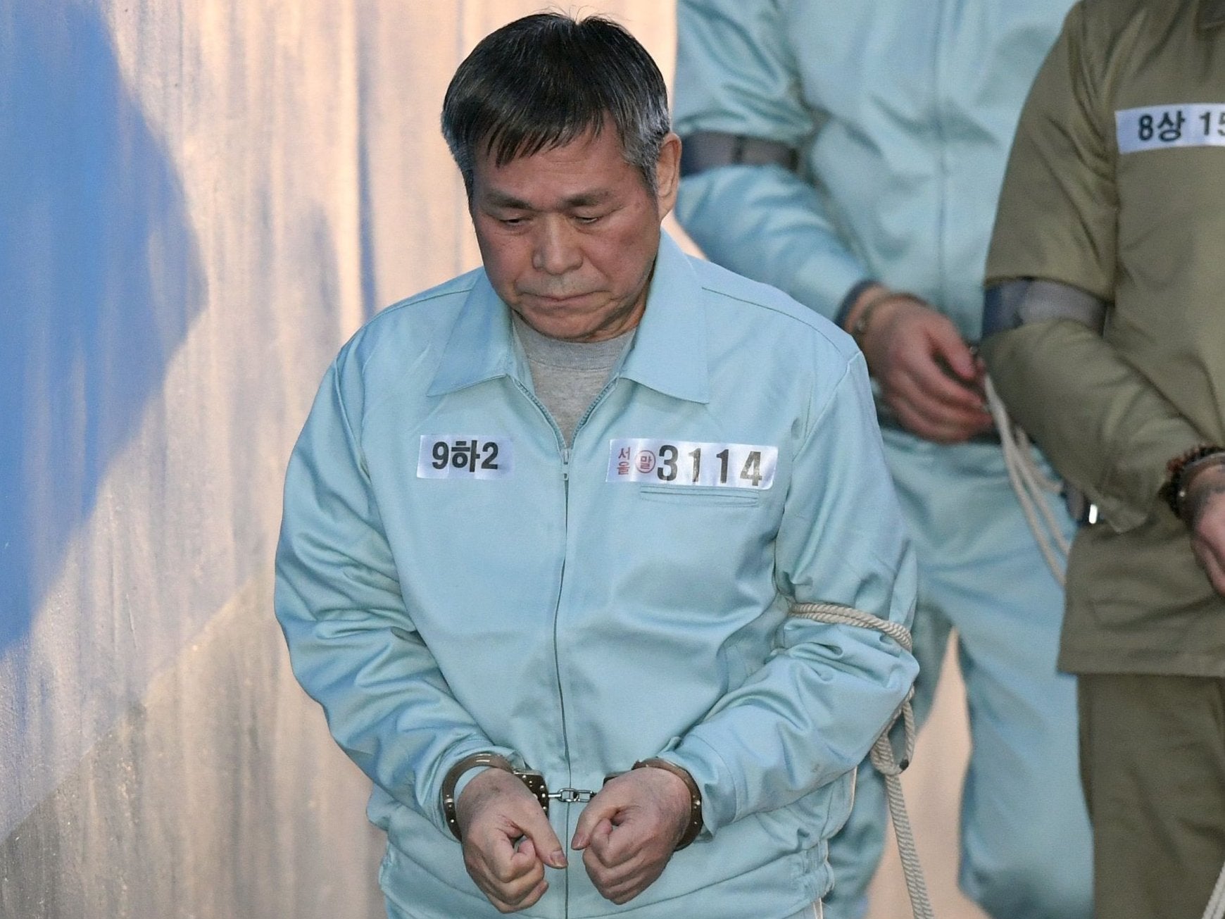 South Korean pastor Lee Jaerock arrives at the Seoul Central District Court to attend his trial in Seoul on 22 November
