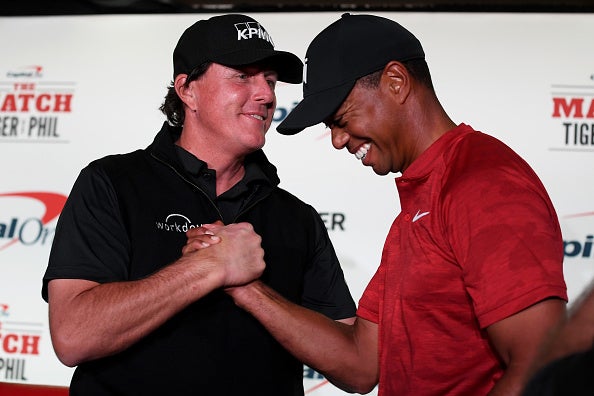 Mickelson and Woods could barely keep a straight face at their boxing style press conference
