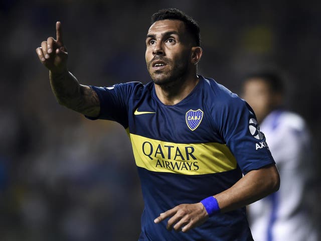 Carlos Tevez of Boca Juniors celebrates after scoring