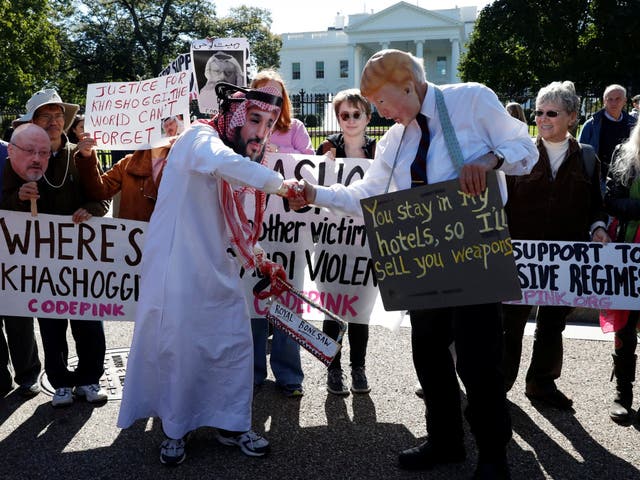 Activists dressed as the Saudi leader and Donald Trump at the White House