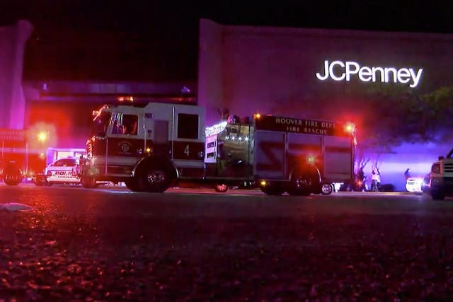 First responders outside the mall after the shooting. Photo via AP