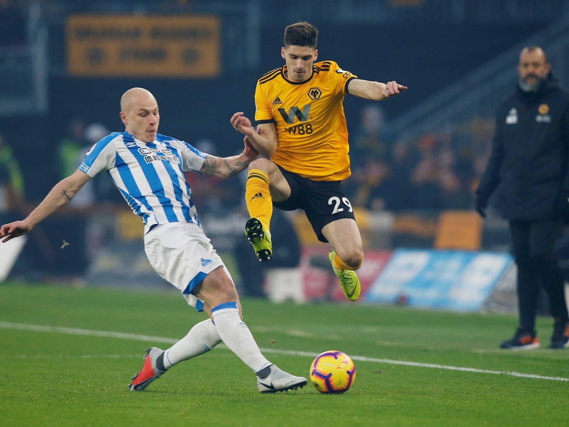 Aaron Mooy gets across to challenge Wolves' Ruben Vinagre