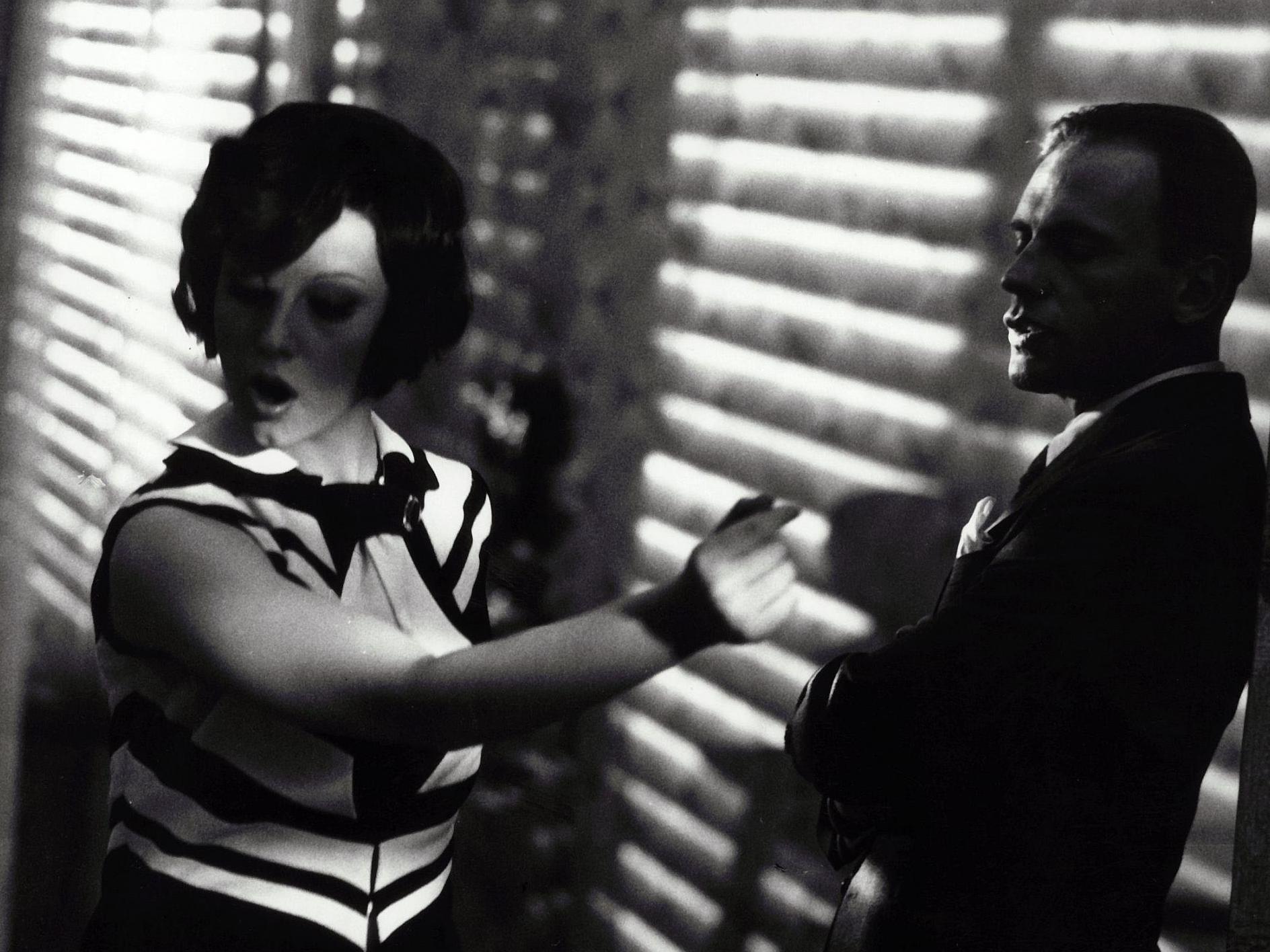 Natural light filtering through Venetian blinds in 'The Conformist', a scene providing stylistic inspiration to Francis Ford Coppola's 'The Godfather'