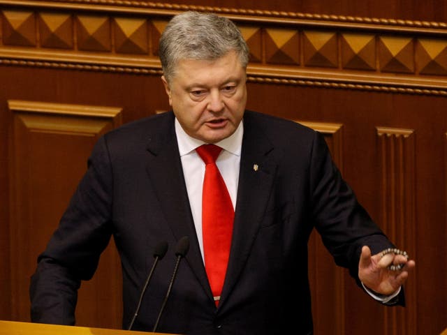 Ukrainian President Petro Poroshenko addresses lawmakers during an emergency session of Ukrainian Parliament in Kiev on 26 November 2018