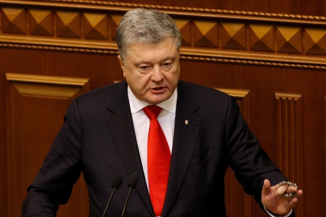 Ukrainian President Petro Poroshenko addresses lawmakers during an emergency session of Ukrainian Parliament in Kiev on 26 November 2018
