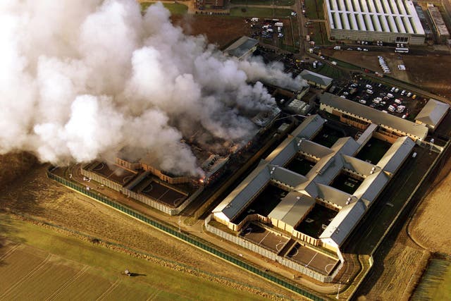 Smoke billows from the Yarl's Wood immigration removal centre near Bedford – detainees set fire to it in 2002