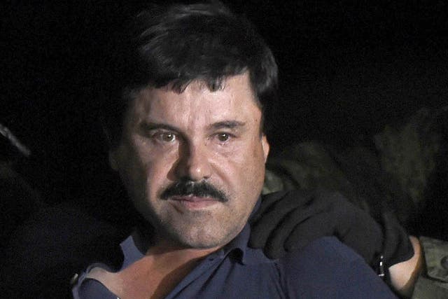 Drug kingpin Joaquin 'El Chapo' Guzman pictured getting escorted into a helicopter at Mexico City's airport in 2016