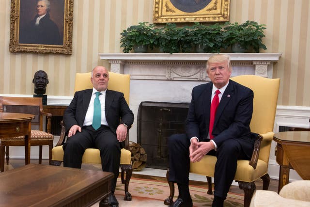 Donald Trump and Haider al-Abadi pose for photos before White House meeting last year