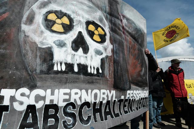 French and German anti-nuclear activists pictured on 24 April 2016 during a commemoration of the Chernobyl nuclear disaster and to protest against the nuclear power plant in Fessenheim, France, the country's oldest reactor (Frederick Florin/