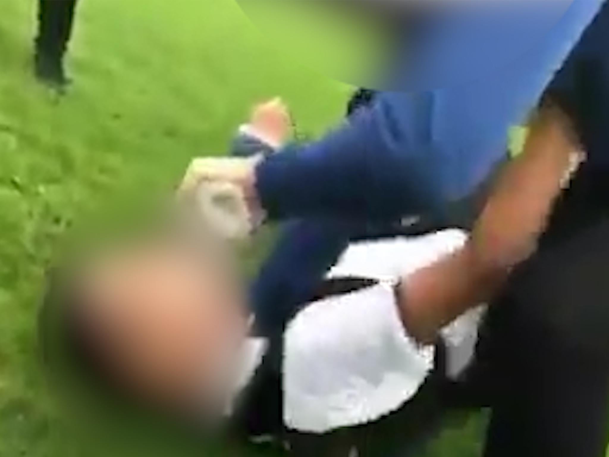 A video shows a 15-year-old boy being grabbed by the neck and thrown to the floor, at a school in Huddersfield last month