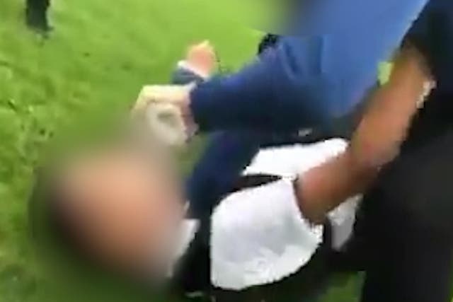 A video shows a 15-year-old boy being grabbed by the neck and thrown to the floor, at a school in Huddersfield last month